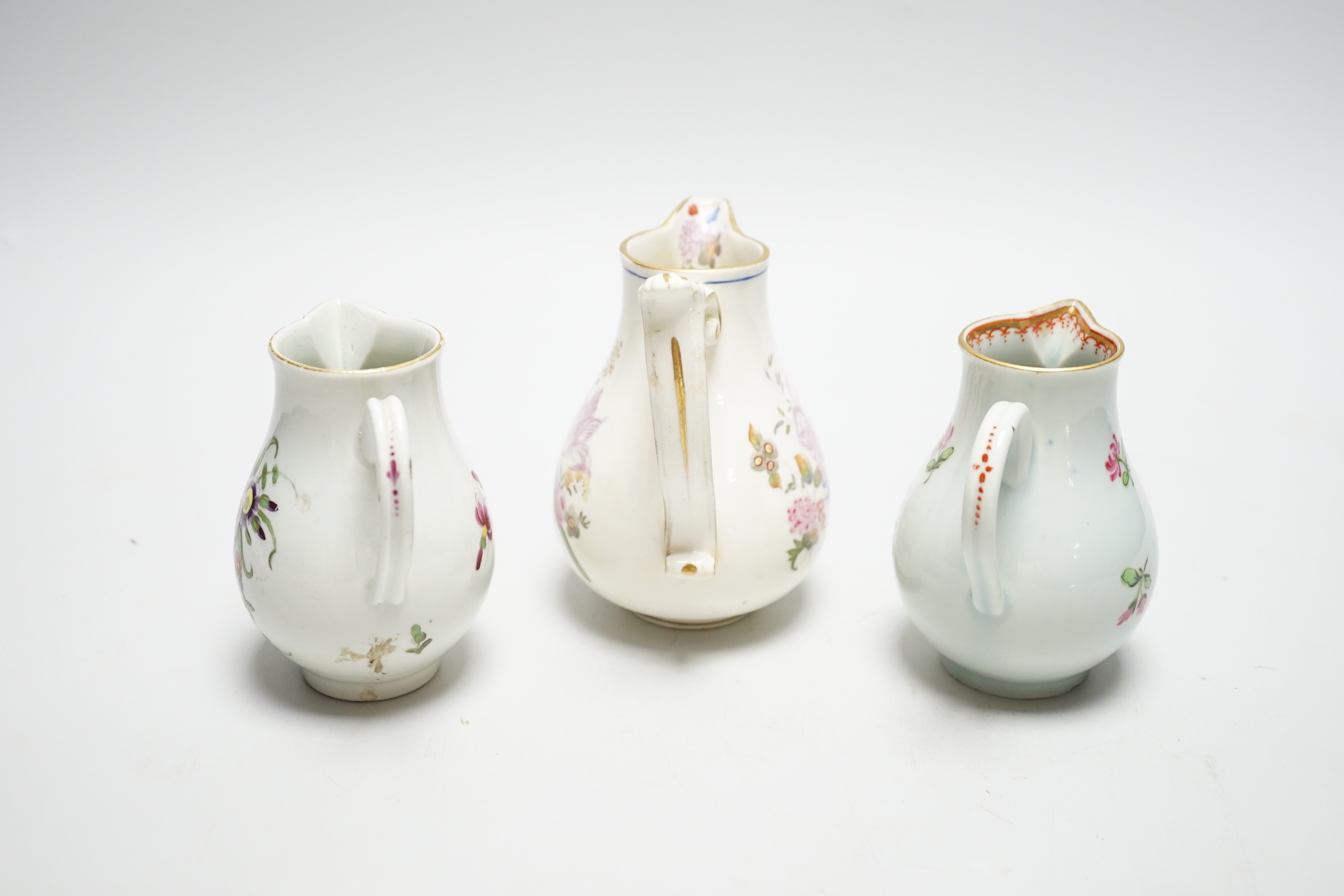 Two Worcester flower painted sparrow-beak jugs, c.1780 and an English porcelain milk jug, c.1825 (3)